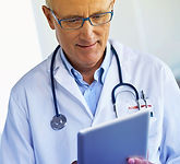 Male Doctor holding an Ipad