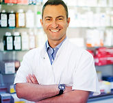 Male Pharmicist wearing a white coat